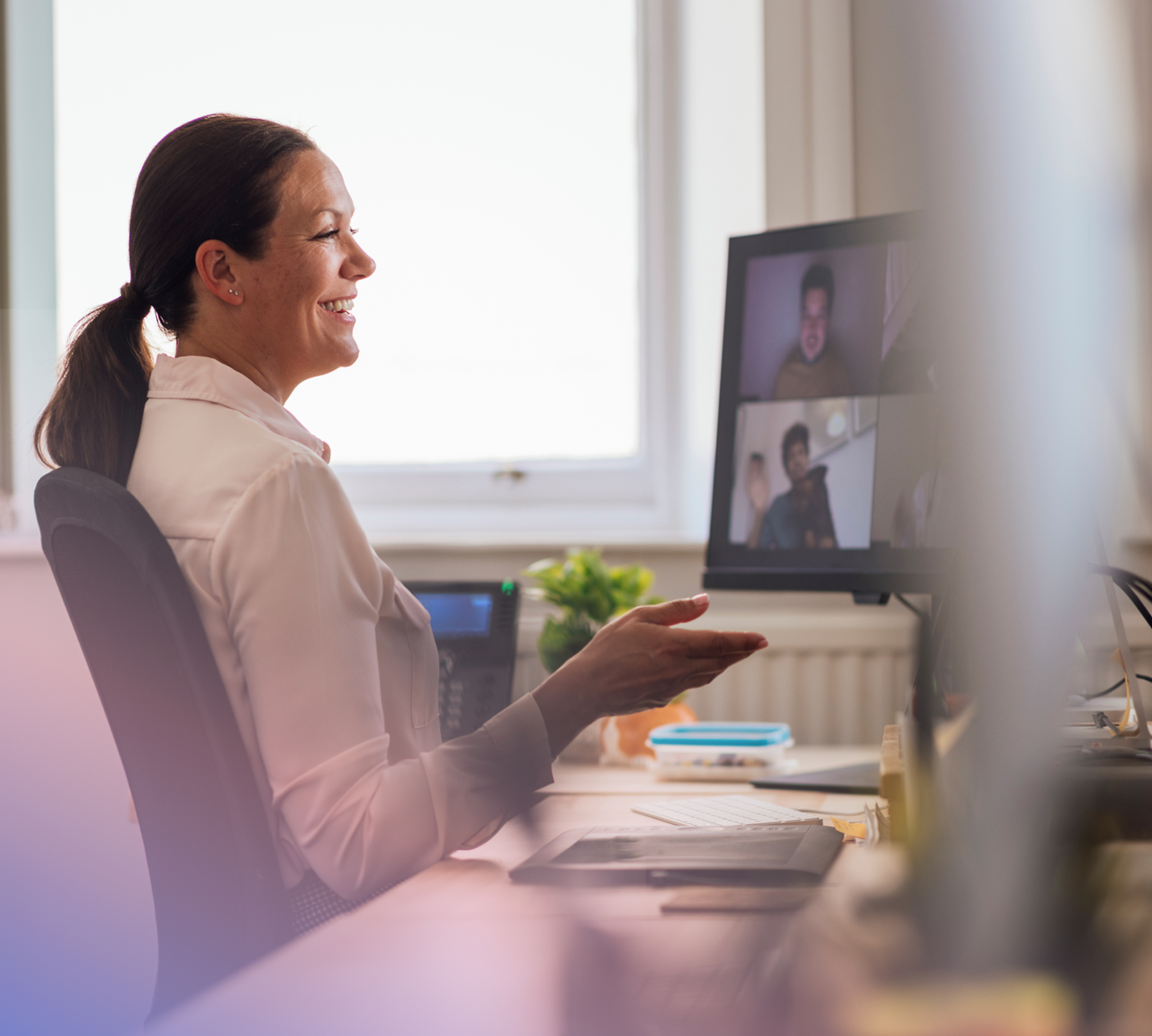 a person sitting at a desk with a computer