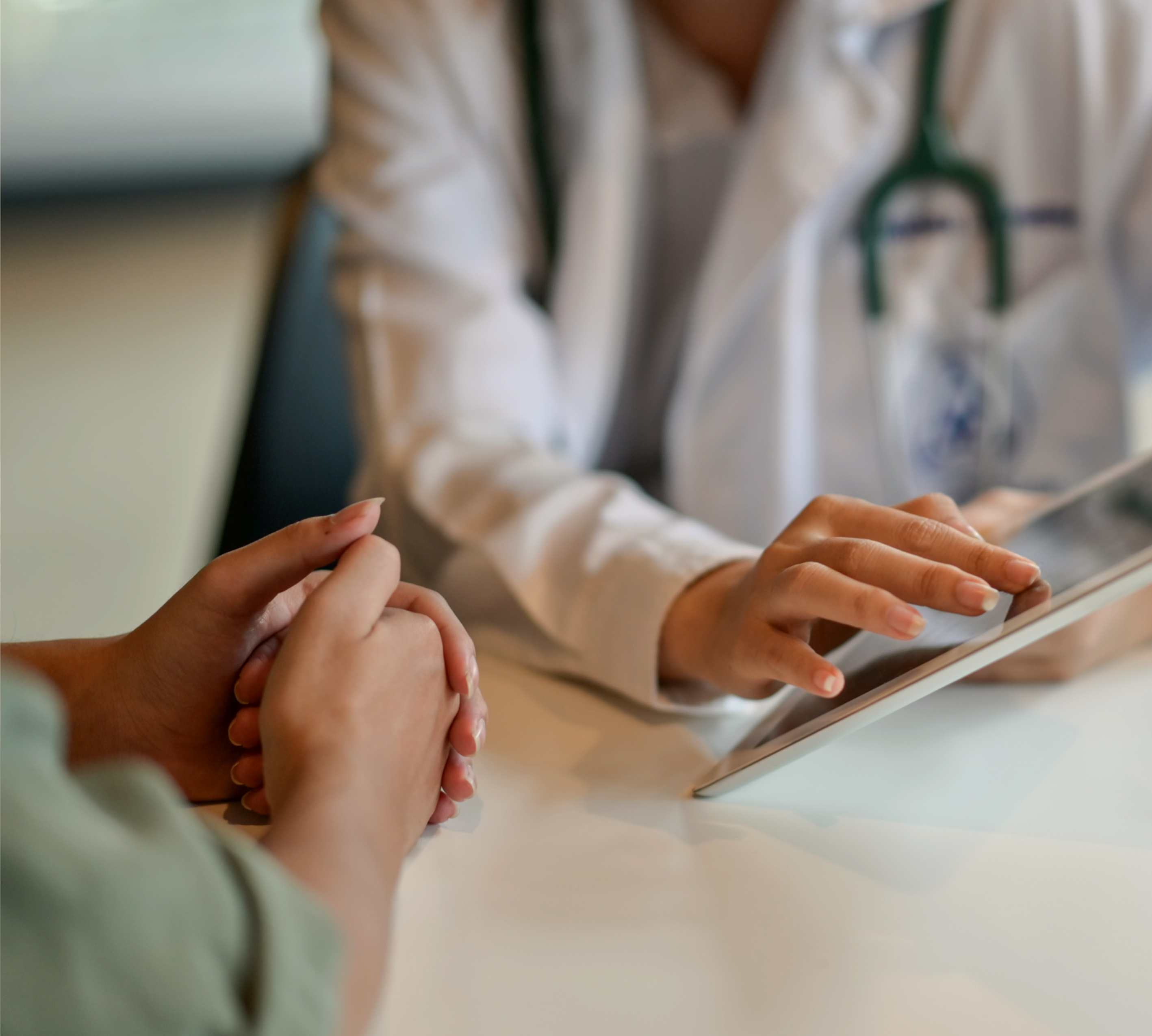 a doctor and patient holding hands