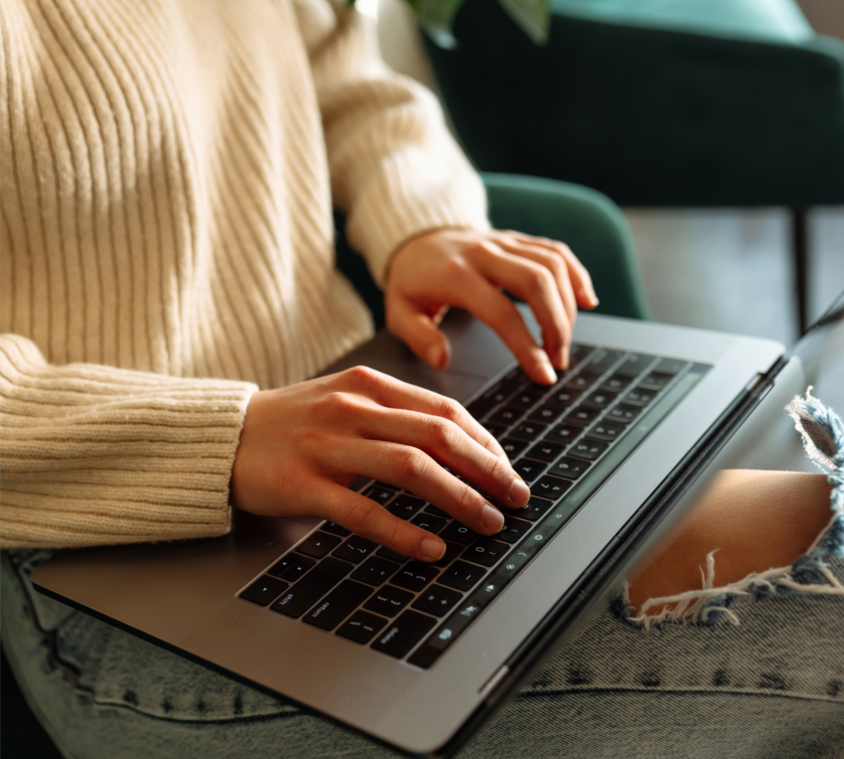 a person typing on a laptop