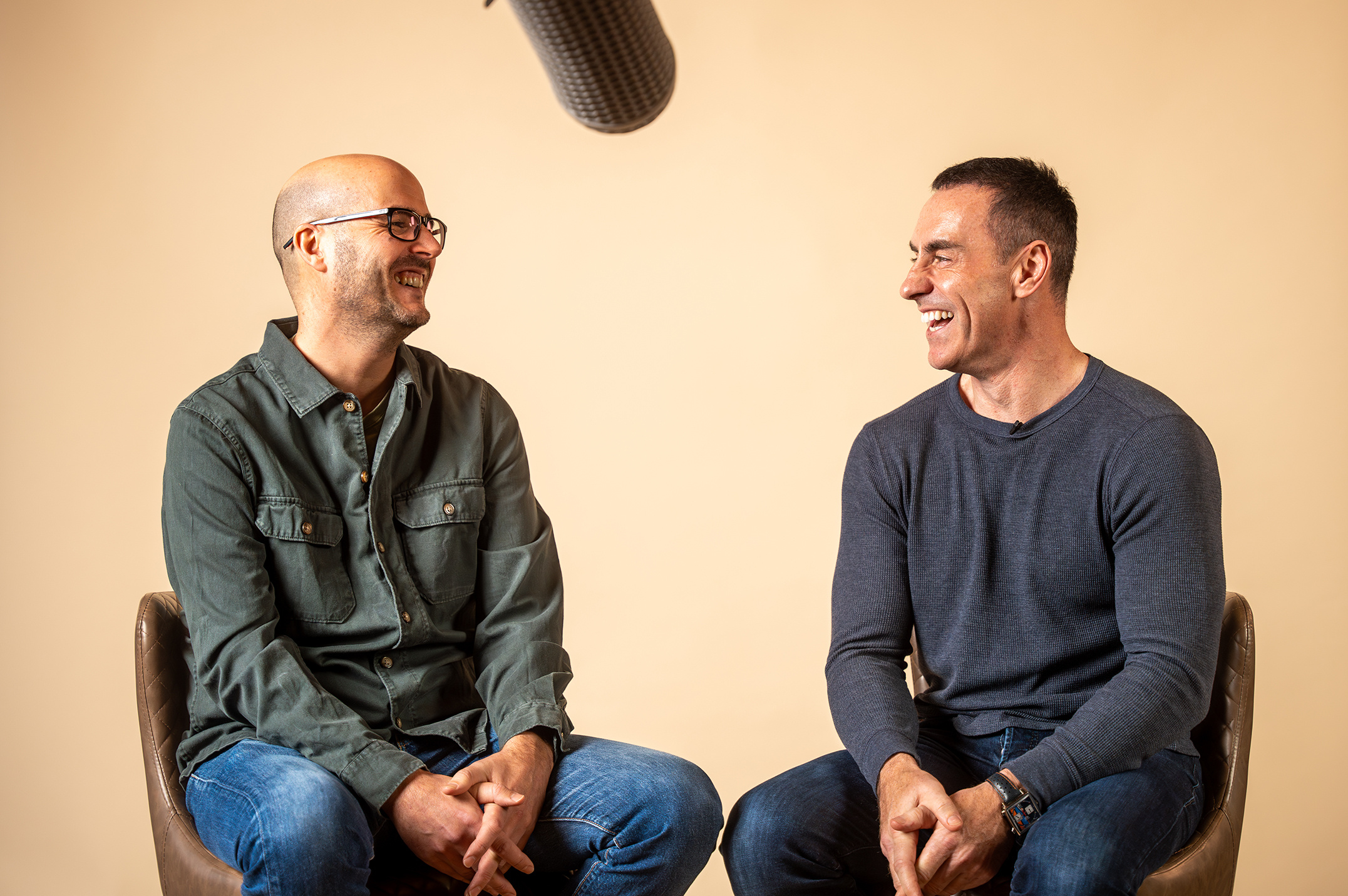Two people talking and smiling
