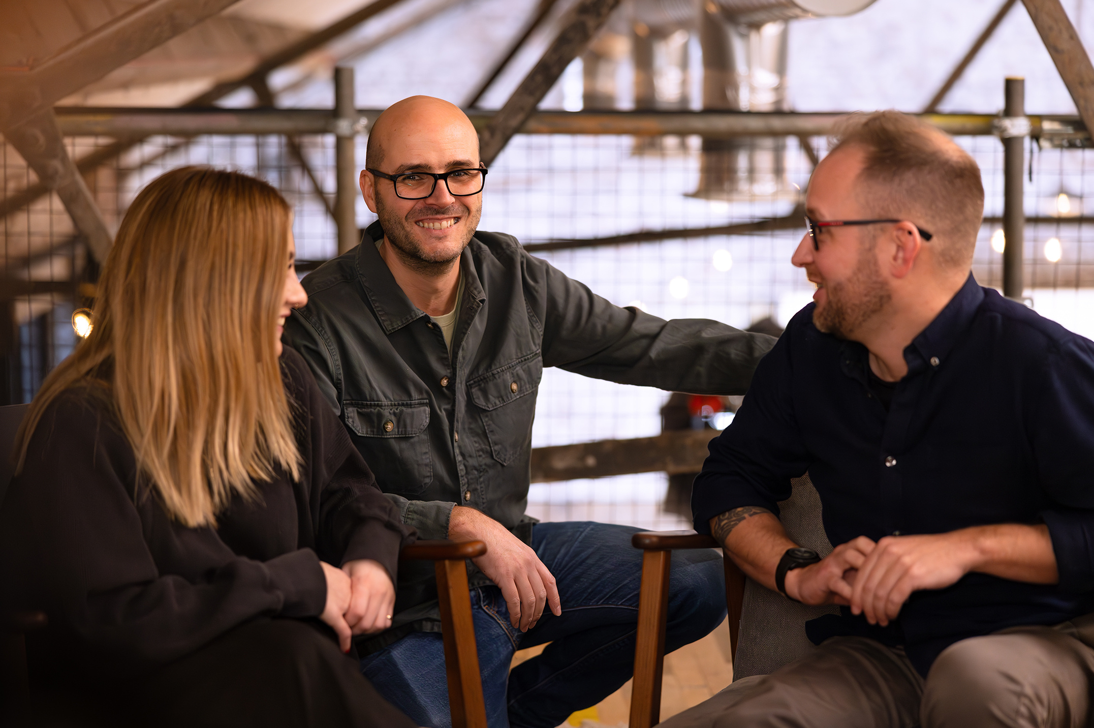Three people talking