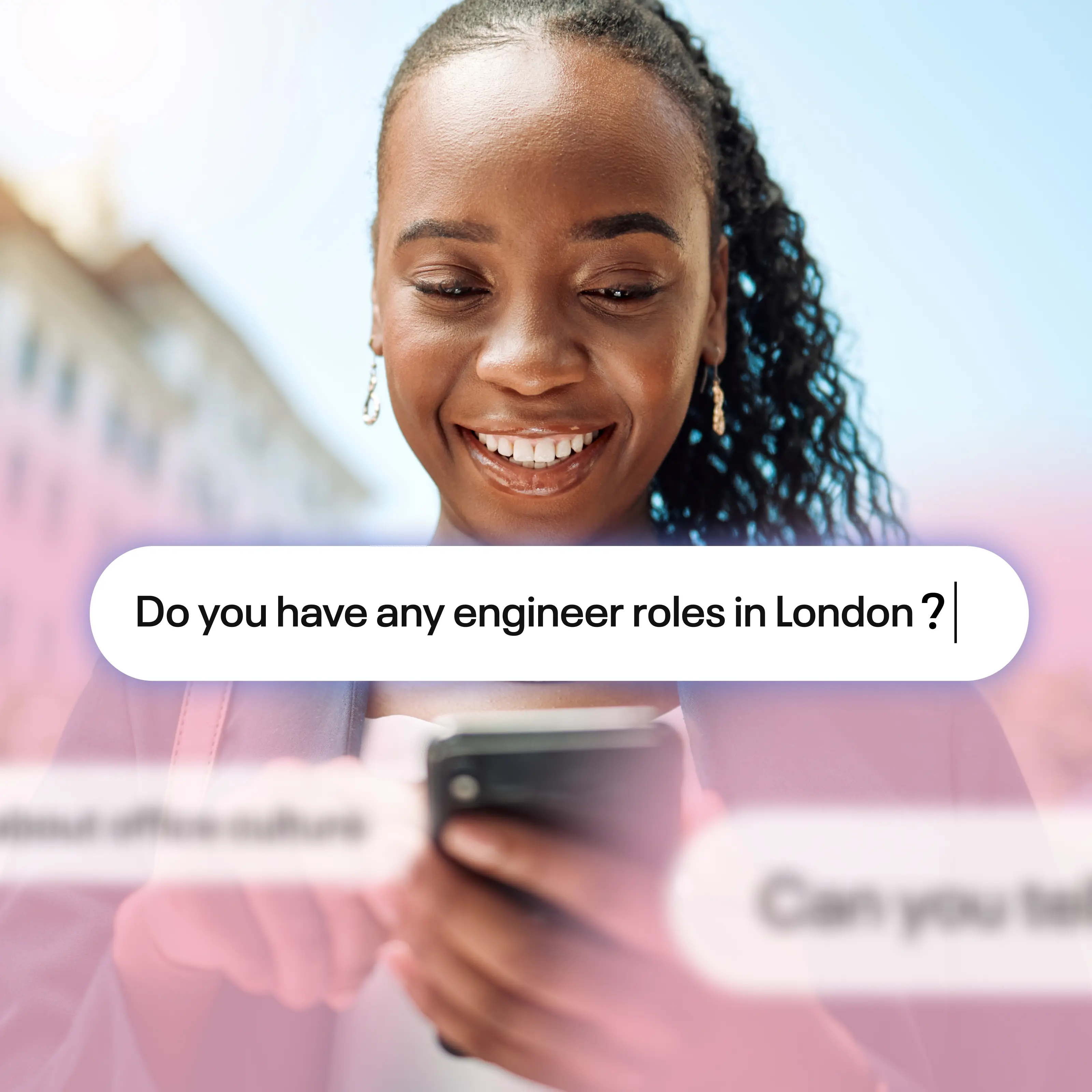 a person smiling at her phone