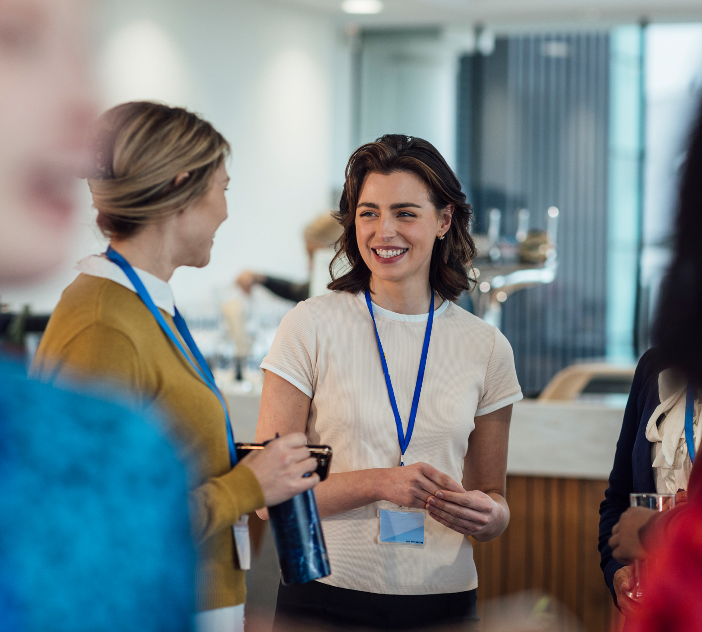 a group of women talking to each other