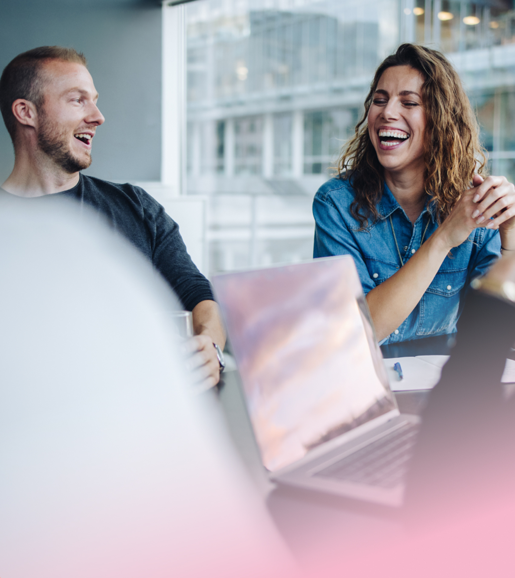 a person and person laughing at a table