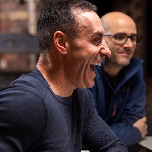 a person laughing at another person