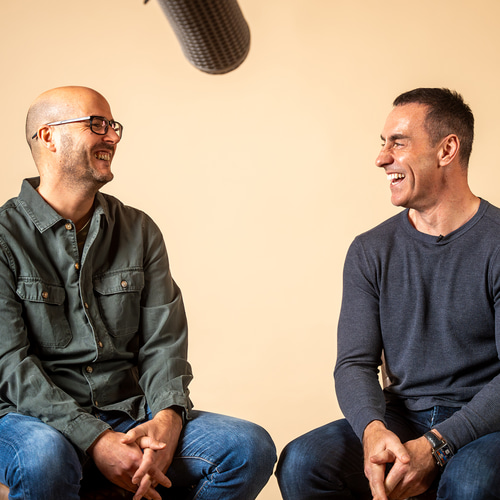 Two people talking and smiling