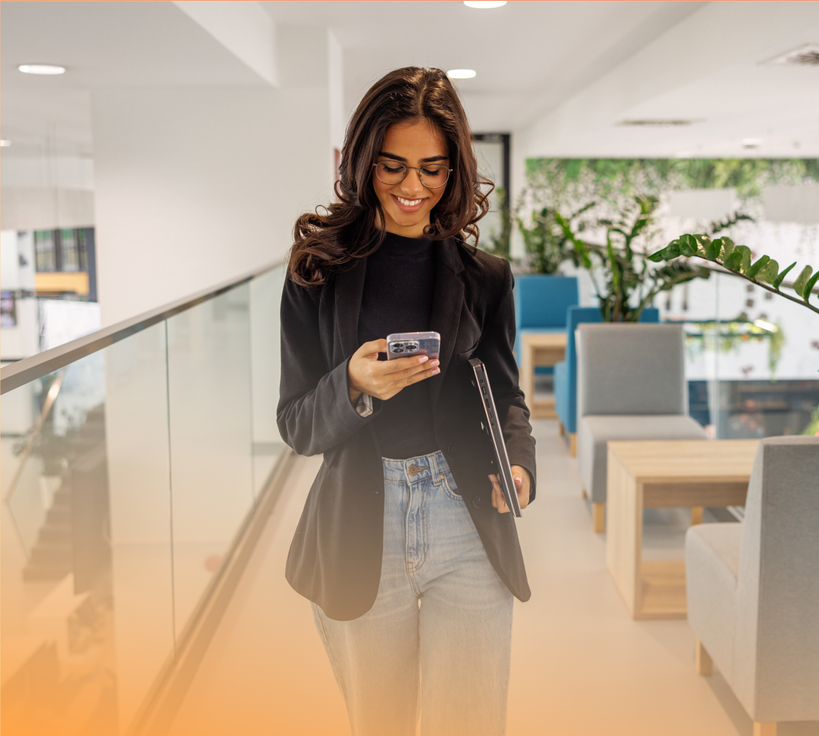 a person standing in a room with a phone